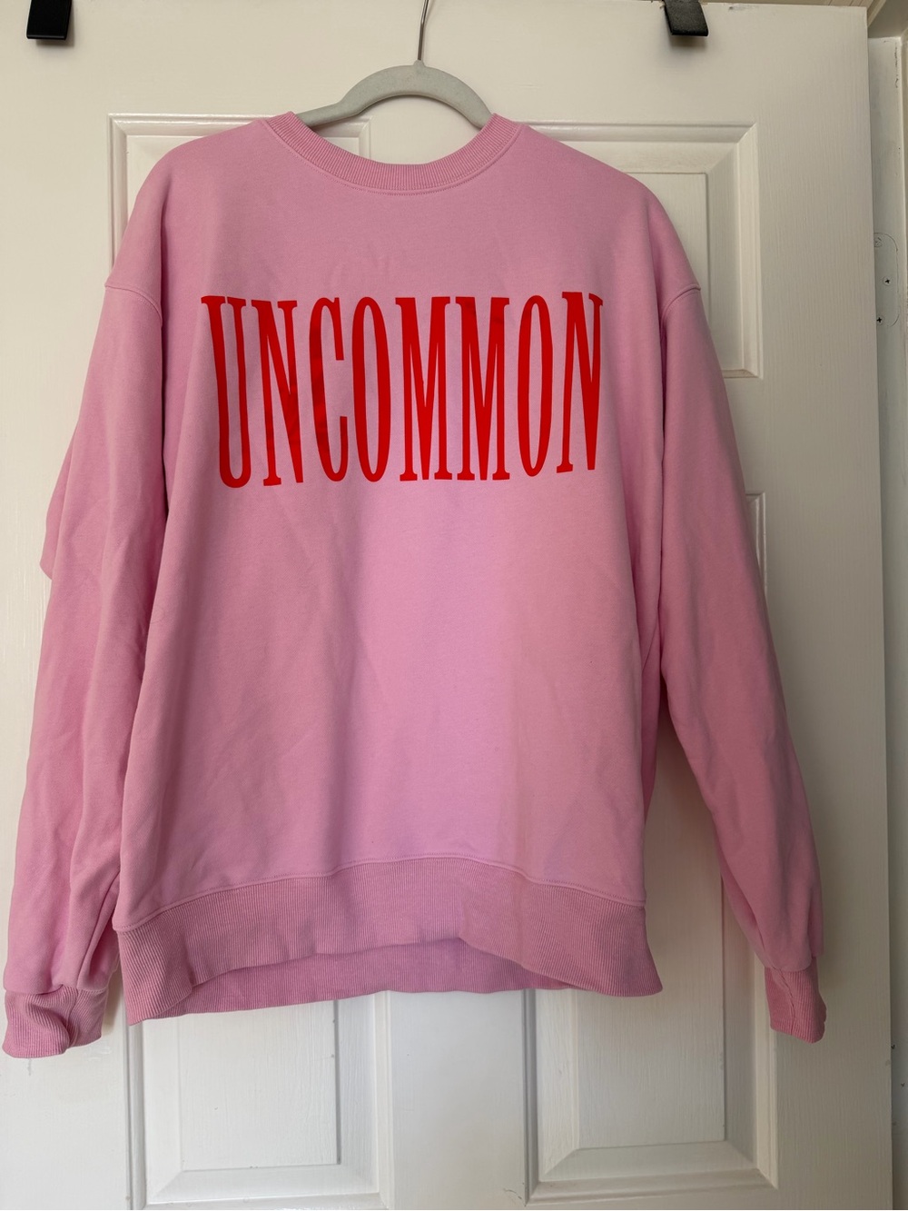 Uncommon James Pink Sweatshirt with Red Logo